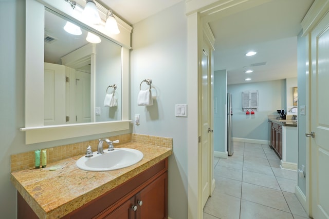 bathroom with vanity, visible vents, baseboards, recessed lighting, and tile patterned floors