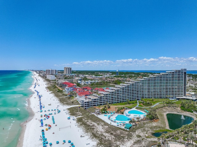 view of urban area featuring expansive coastline and a pool area