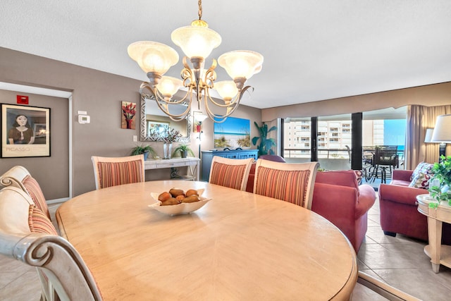 dining room featuring a chandelier and tile patterned floors