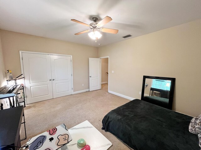 829 Fairview Dr Unit 1, Fort Walton Beach, FL 32548 - bedroom with light colored carpet, baseboards, a closet, and ceiling fan