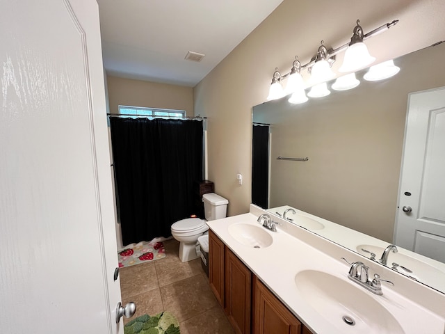 829 Fairview Dr Unit 1, Fort Walton Beach, FL 32548 - full bathroom featuring toilet, double vanity, a shower with curtain, and tile patterned flooring
