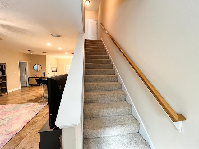 829 Fairview Dr Unit 1, Fort Walton Beach, FL 32548 - stairway featuring recessed lighting, tile patterned flooring, and baseboards