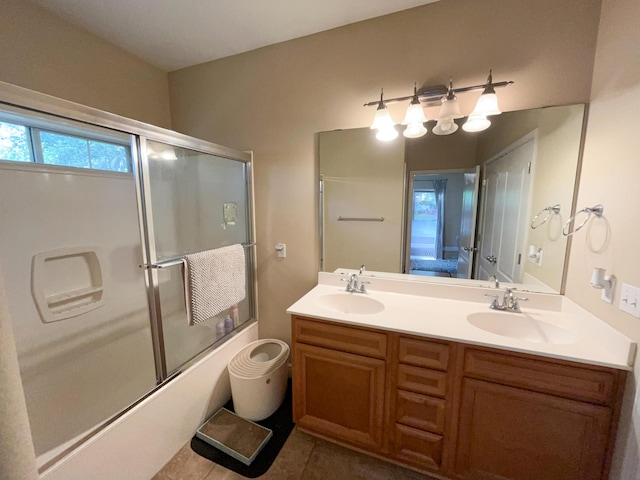 829 Fairview Dr Unit 1, Fort Walton Beach, FL 32548 - bathroom featuring double vanity, bath / shower combo with glass door, and tile patterned flooring