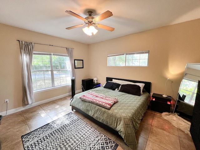 829 Fairview Dr Unit 1, Fort Walton Beach, FL 32548 - tiled bedroom with multiple windows, baseboards, and a ceiling fan