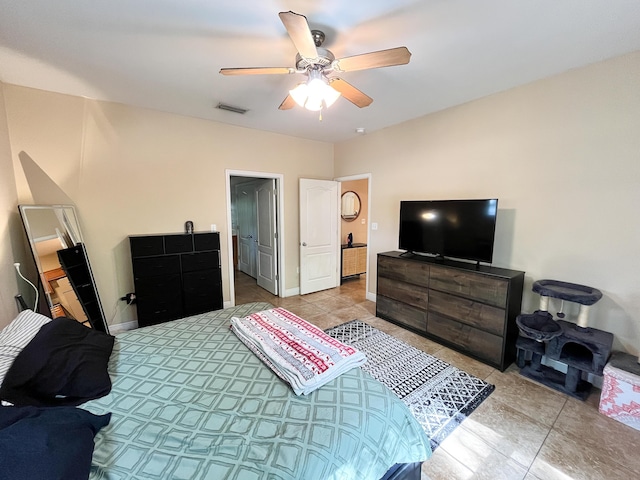 829 Fairview Dr Unit 1, Fort Walton Beach, FL 32548 - bedroom with light tile patterned flooring, a ceiling fan, and baseboards