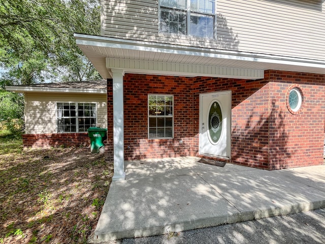 829 Fairview Dr Unit 1, Fort Walton Beach, FL 32548 - property entrance with brick siding and a patio