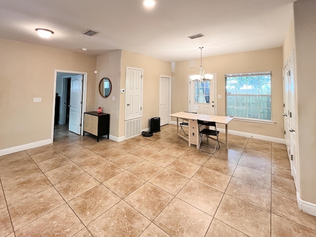 829 Fairview Dr Unit 1, Fort Walton Beach, FL 32548 - dining room with light tile patterned floors, a chandelier, and baseboards