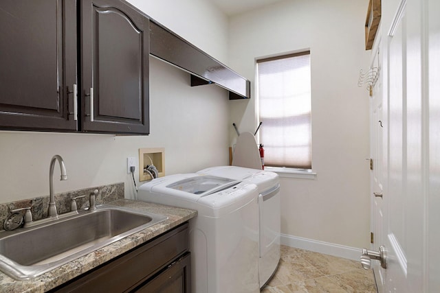 674 Emerald Bay Dr, Destin, FL 32541 - laundry area featuring washing machine and clothes dryer, cabinet space, and baseboards