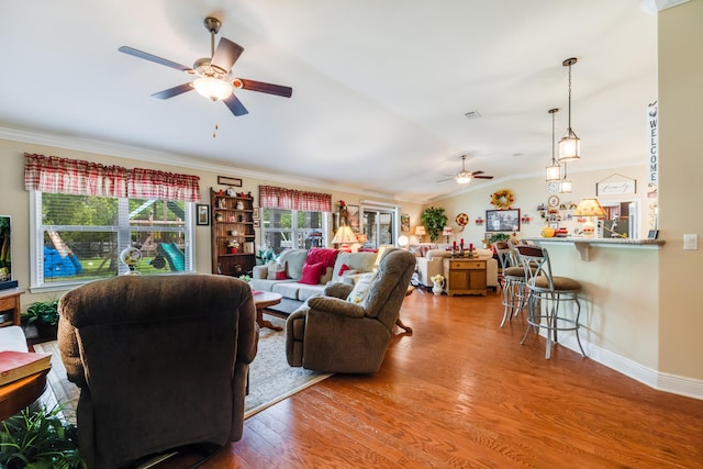 6444 Welannee Blvd, Laurel Hill, FL 32567 - living room featuring a ceiling fan, crown molding, wood finished floors, vaulted ceiling, and baseboards