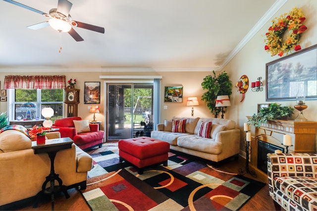 6444 Welannee Blvd, Laurel Hill, FL 32567 - living area featuring wood finished floors, crown molding, ceiling fan, and a fireplace