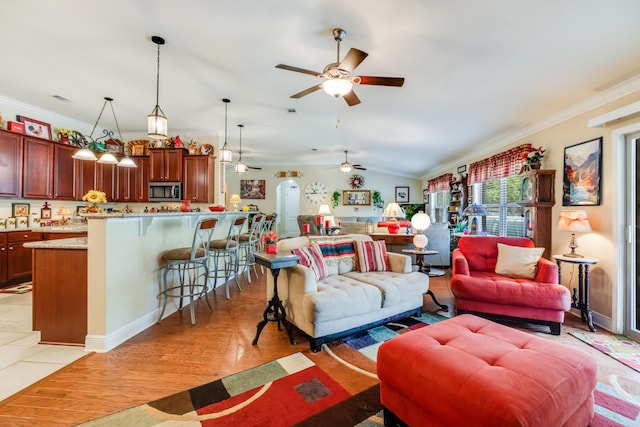 6444 Welannee Blvd, Laurel Hill, FL 32567 - living room with ceiling fan, crown molding, lofted ceiling, and light wood-style floors