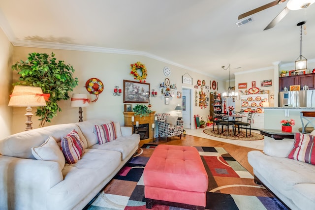 6444 Welannee Blvd, Laurel Hill, FL 32567 - living area featuring a ceiling fan, crown molding, a chandelier, and wood finished floors