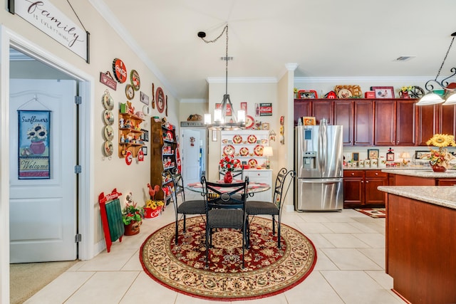 6444 Welannee Blvd, Laurel Hill, FL 32567 - kitchen featuring stainless steel fridge with ice dispenser, dark brown cabinets, ornamental molding, pendant lighting, and light tile patterned floors