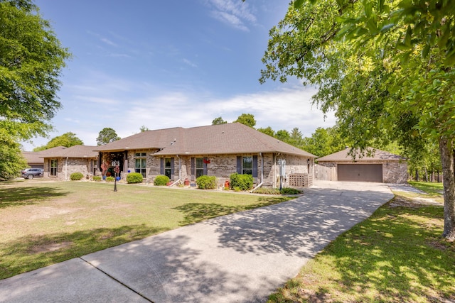 6444 Welannee Blvd, Laurel Hill, FL 32567 - ranch-style home featuring a detached garage, a front lawn, brick siding, and an outbuilding