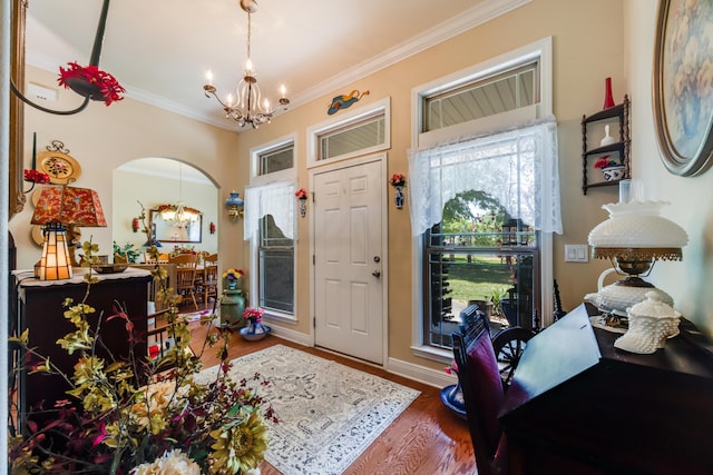 6444 Welannee Blvd, Laurel Hill, FL 32567 - entryway with a chandelier, ornamental molding, wood finished floors, and arched walkways