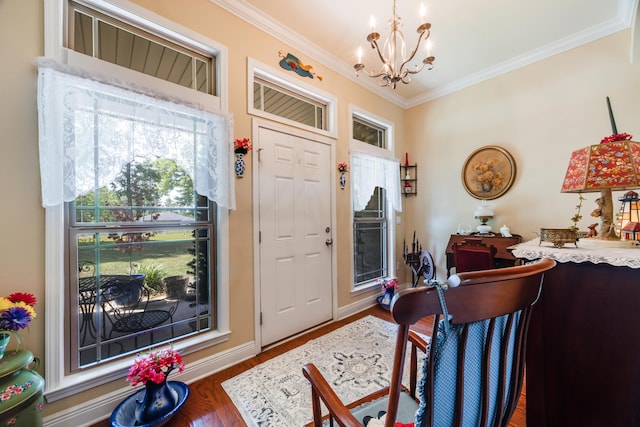 6444 Welannee Blvd, Laurel Hill, FL 32567 - entrance foyer featuring a chandelier, crown molding, wood finished floors, and baseboards