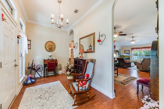 6444 Welannee Blvd, Laurel Hill, FL 32567 - entryway featuring arched walkways, crown molding, wood finished floors, baseboards, and a chandelier