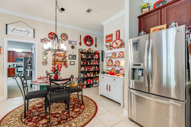6444 Welannee Blvd, Laurel Hill, FL 32567 - kitchen with appliances with stainless steel finishes, light tile patterned floors, crown molding, a chandelier, and pendant lighting