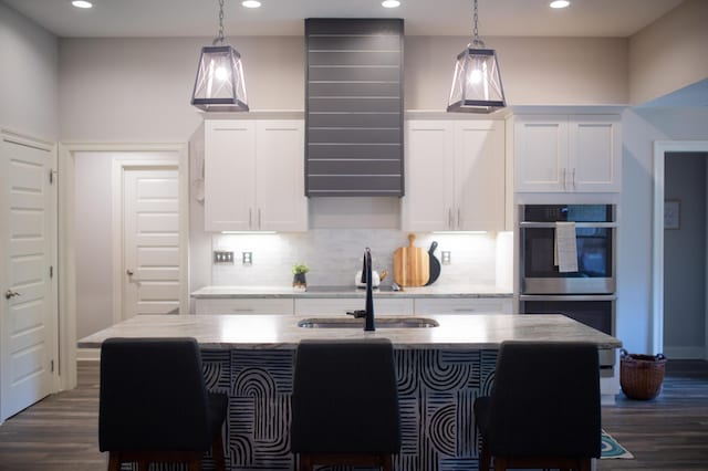 kitchen featuring recessed lighting, a sink, and dark wood finished floors