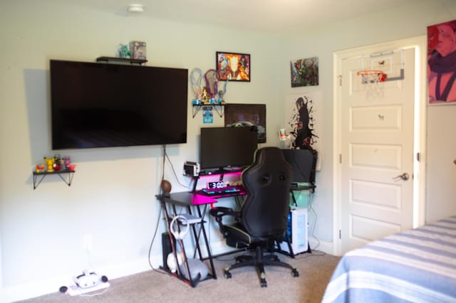 bedroom with carpet floors and baseboards