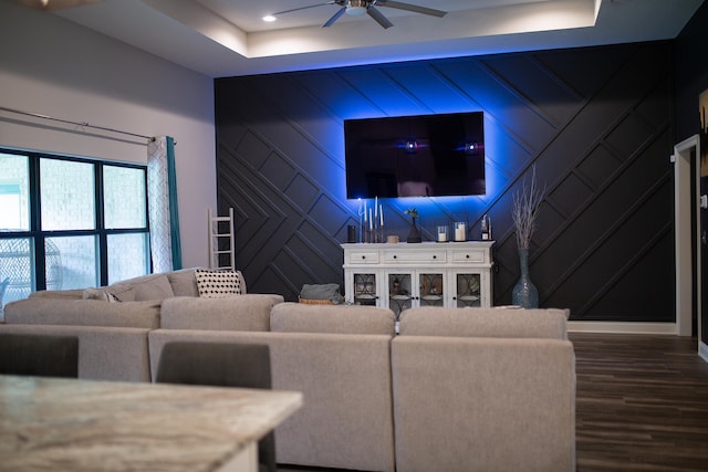 living room with ceiling fan, baseboards, dark wood-style floors, a decorative wall, and recessed lighting
