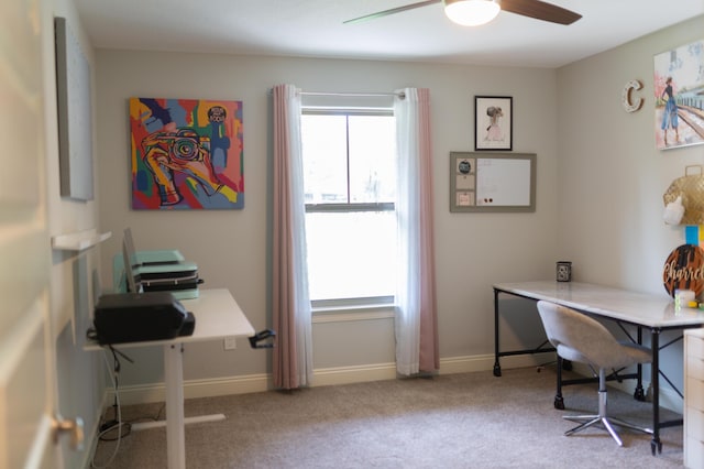 office area featuring carpet flooring, a ceiling fan, and baseboards