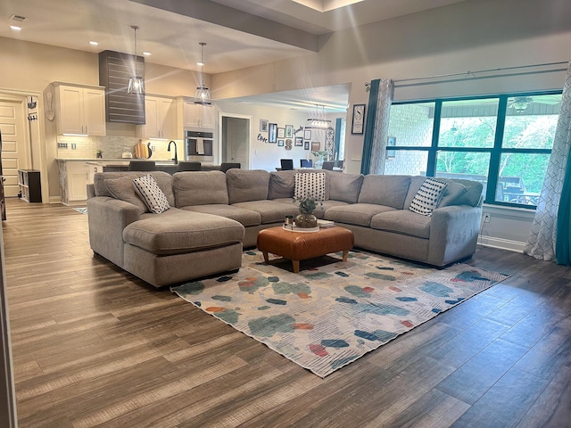 living room featuring recessed lighting and dark wood-type flooring