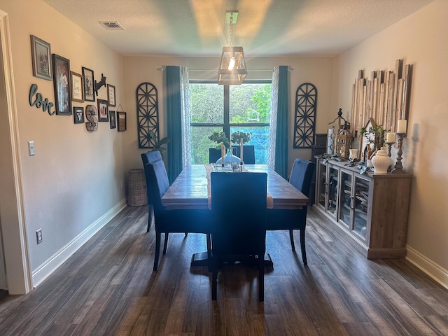 dining area with baseboards, visible vents, and dark wood-style floors
