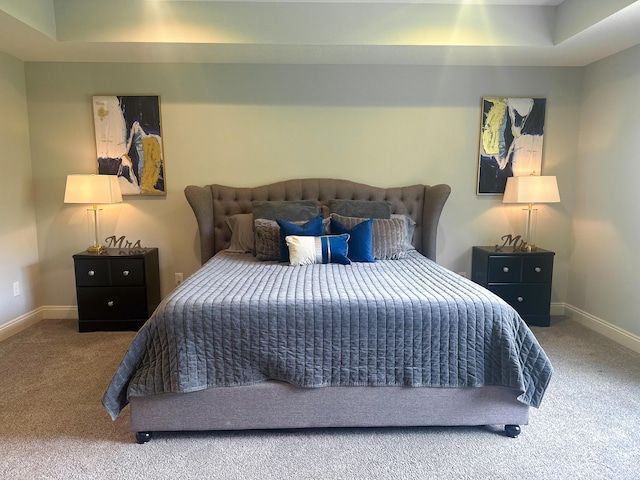 bedroom featuring carpet flooring and baseboards