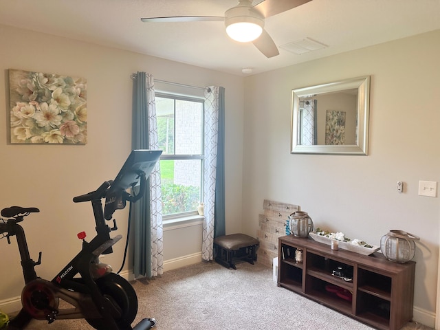 workout room featuring carpet flooring, ceiling fan, visible vents, and baseboards