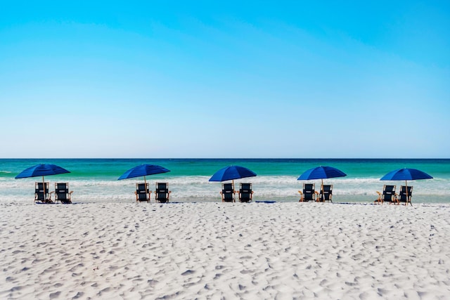 property view of water featuring a beach view