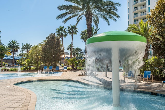 community pool featuring a patio area
