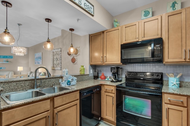 kitchen with light stone countertops, hanging light fixtures, a sink, black appliances, and tasteful backsplash