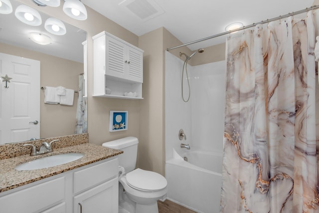 full bathroom featuring toilet, vanity, visible vents, and shower / tub combo