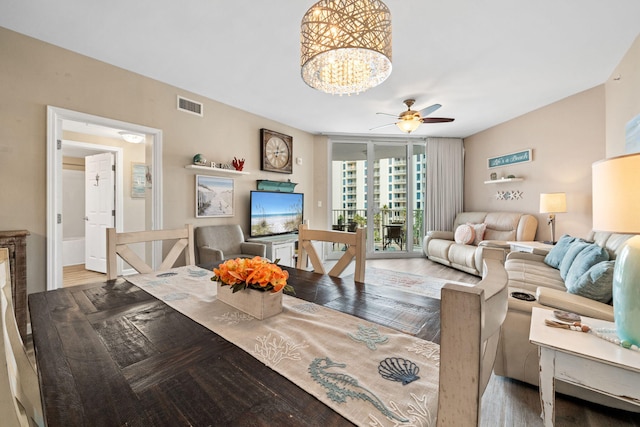 4203 Indian Bayou Trl Unit 1503, Destin, FL 32541 - living room with a ceiling fan, wood finished floors, a chandelier, and a wall of windows