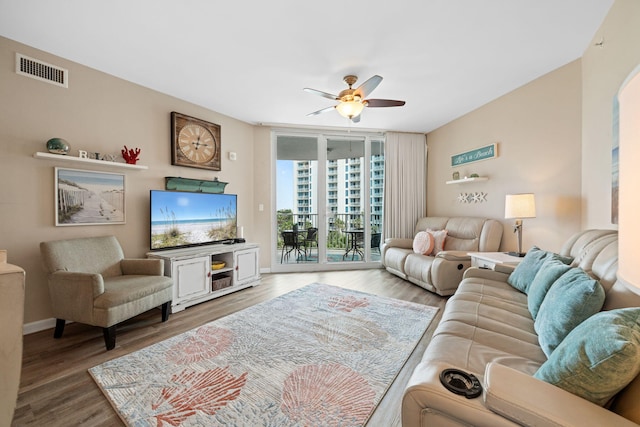 4203 Indian Bayou Trl Unit 1503, Destin, FL 32541 - living area with ceiling fan, wood finished floors, floor to ceiling windows, and baseboards