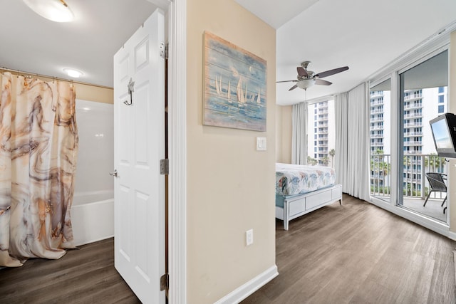 4203 Indian Bayou Trl Unit 1503, Destin, FL 32541 - bedroom featuring wood finished floors, baseboards, a ceiling fan, and access to outside