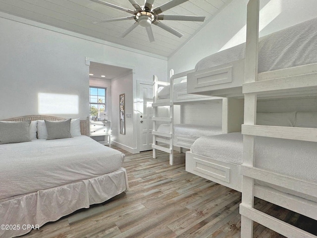 9614 Beach Blvd Unit D, Panama City Beach, FL 32408 - bedroom with high vaulted ceiling, wood ceiling, and wood finished floors