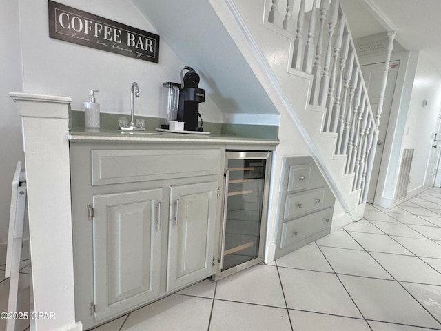 9614 Beach Blvd Unit D, Panama City Beach, FL 32408 - bar with wine cooler, light tile patterned flooring, wet bar, and lofted ceiling