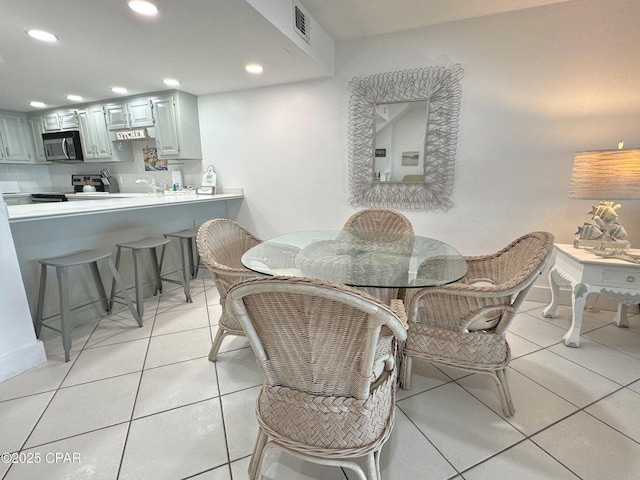 9614 Beach Blvd Unit D, Panama City Beach, FL 32408 - dining room with recessed lighting, light tile patterned flooring, and visible vents