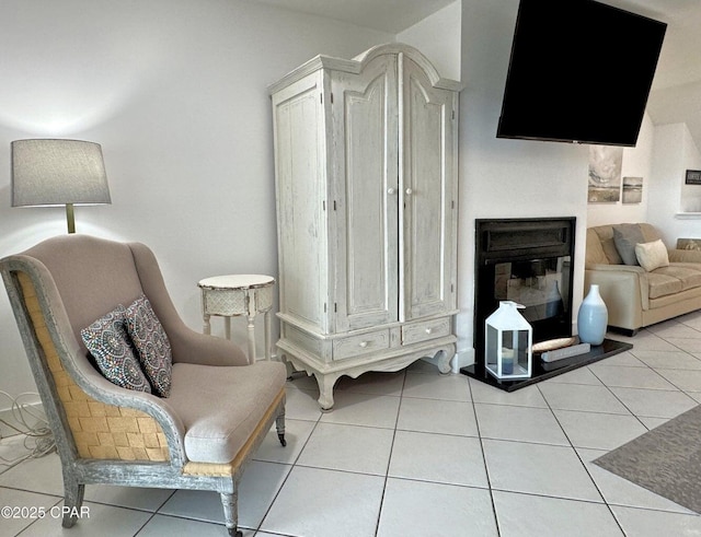 9614 Beach Blvd Unit D, Panama City Beach, FL 32408 - living area with a glass covered fireplace and light tile patterned floors