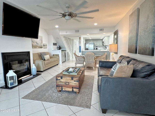 9614 Beach Blvd Unit D, Panama City Beach, FL 32408 - living room featuring light tile patterned flooring, a glass covered fireplace, a ceiling fan, recessed lighting, and visible vents
