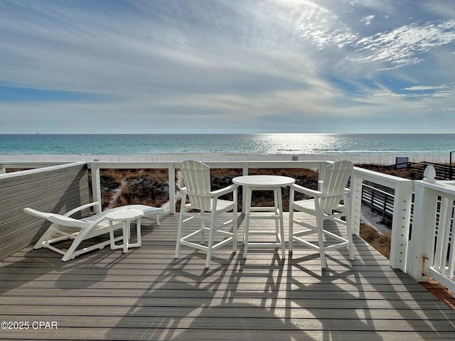 9614 Beach Blvd Unit D, Panama City Beach, FL 32408 - wooden deck featuring a water view and a view of the beach