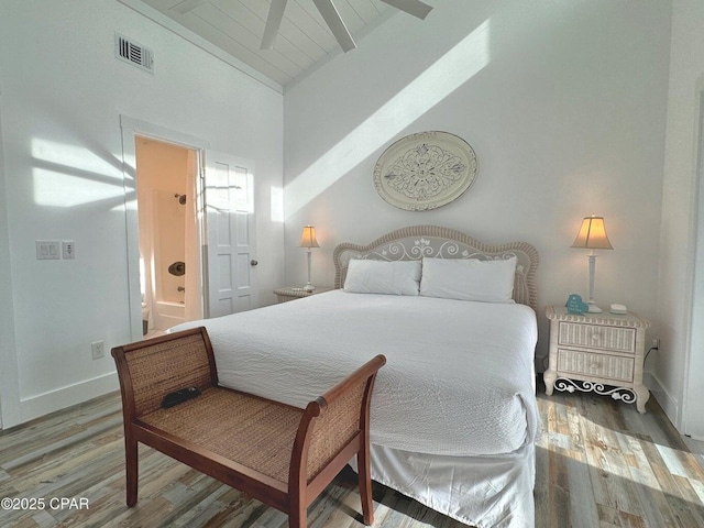 9614 Beach Blvd Unit D, Panama City Beach, FL 32408 - bedroom featuring wood finished floors, baseboards, beam ceiling, and visible vents