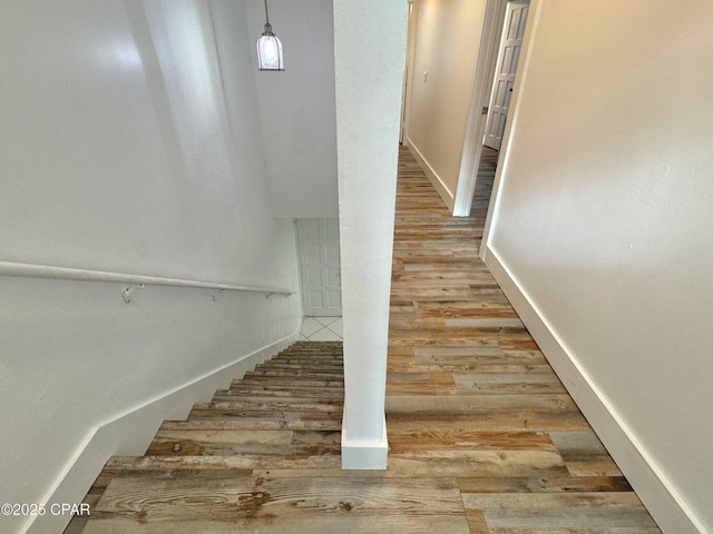 9614 Beach Blvd Unit D, Panama City Beach, FL 32408 - stairs featuring baseboards and wood finished floors