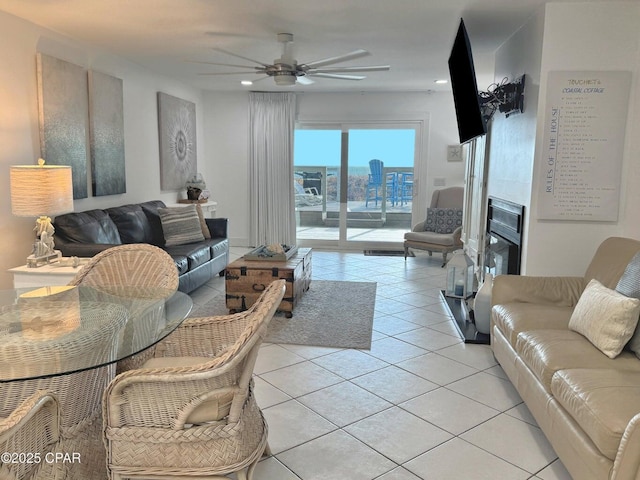 9614 Beach Blvd Unit D, Panama City Beach, FL 32408 - living area with light tile patterned floors, ceiling fan, a glass covered fireplace, and recessed lighting