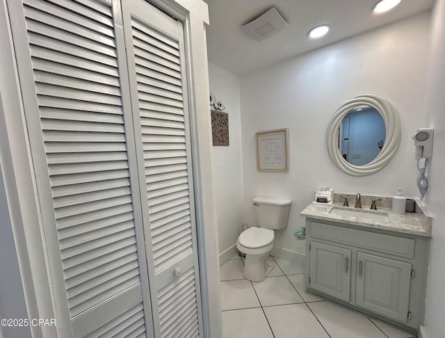 9614 Beach Blvd Unit D, Panama City Beach, FL 32408 - bathroom with tile patterned flooring, vanity, toilet, baseboards, and a closet