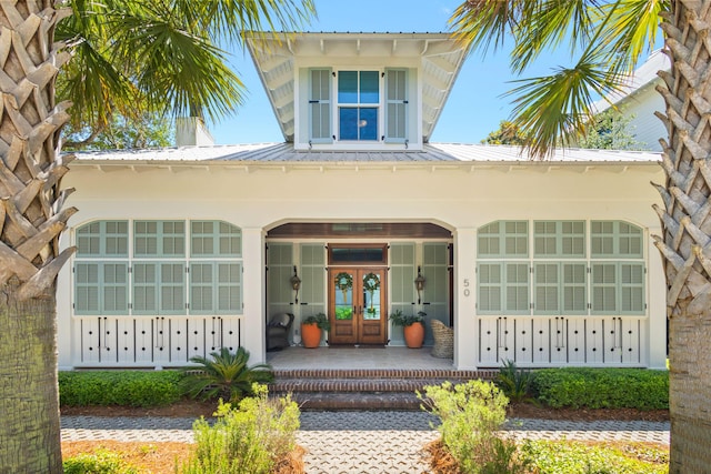 50 Camellia St, Santa Rosa Beach, FL 32459 - entrance to property featuring french doors and metal roof