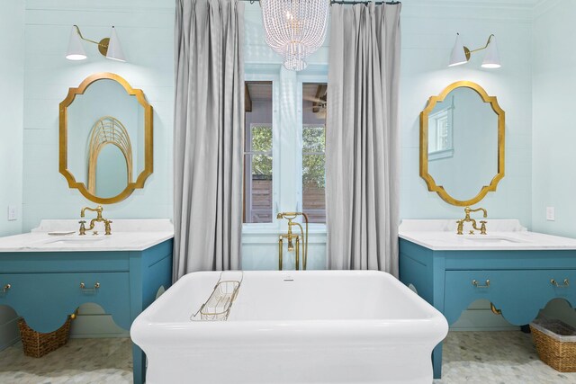 50 Camellia St, Santa Rosa Beach, FL 32459 - bathroom with a chandelier, a freestanding bath, and two vanities