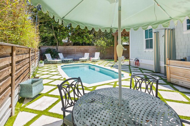 50 Camellia St, Santa Rosa Beach, FL 32459 - view of swimming pool featuring a patio area and a fenced backyard
